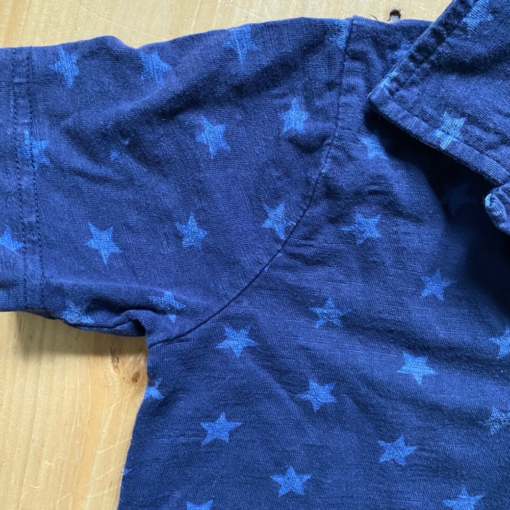 Mini boden collared shirt with star pattern.